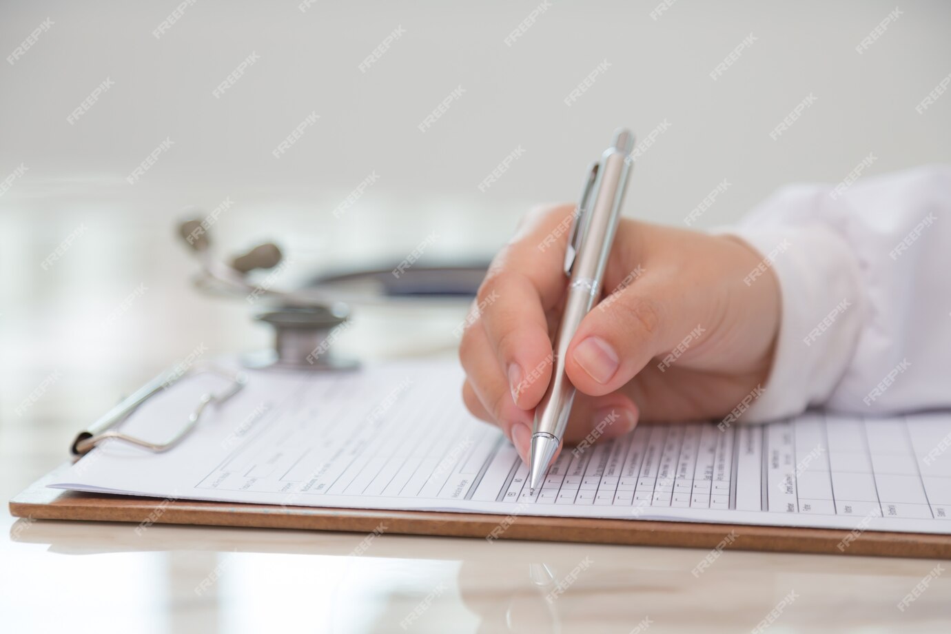 doctor filling out medical form 1232 367